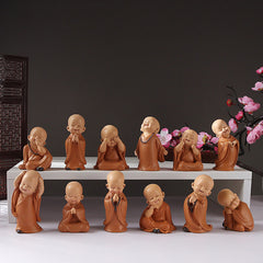 Mini Praying Monk Decor – small resin monk in meditation pose with orange robe, zen figurine