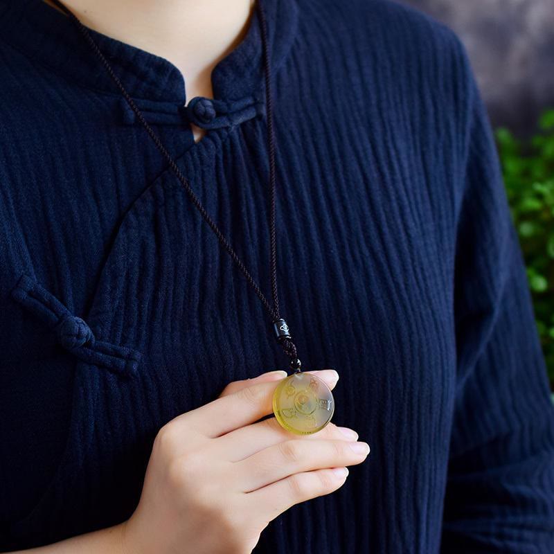 Yellow Jade Yin-Yang Pendant - carved stone tai chi necklace worn on model, Chinese spiritual jewelry