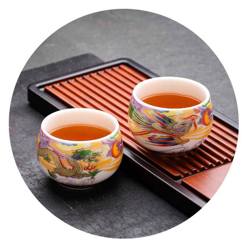 Dragon Phoenix Ceramic Teacup - Filled dragon and phoenix cups on slatted tray, auspicious