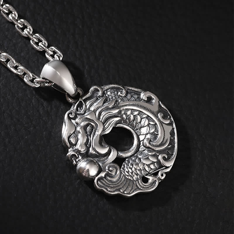 Dragon Koi Pendant Detail - swimming koi beneath coiled dragon in relief, wealth charm
