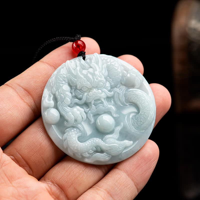 Chinese Zodiac Dragon Jade Amulet Necklace - jade dragon pendant held in hand showing actual size