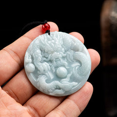 Chinese Zodiac Dragon Jade Amulet Necklace - jade dragon pendant held in hand showing actual size