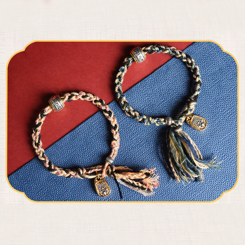 Zakiram Goddess Bracelet – Decorative framed flat lay of two braided cord colorways with metal charms