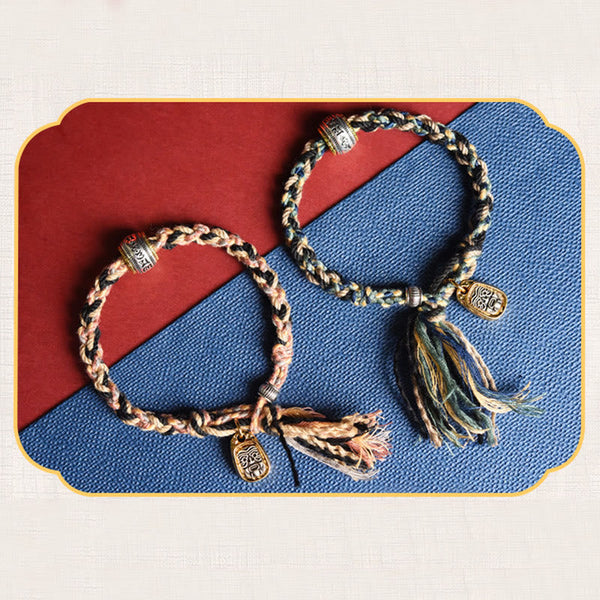 Zakiram Goddess Bracelet – Decorative framed flat lay of two braided cord colorways with metal charms