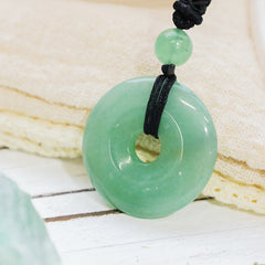 Lucky Coin Pendant Healing Crystal Gemstone Necklace – Pale green aventurine donut pendant with accent bead on black knotted cord