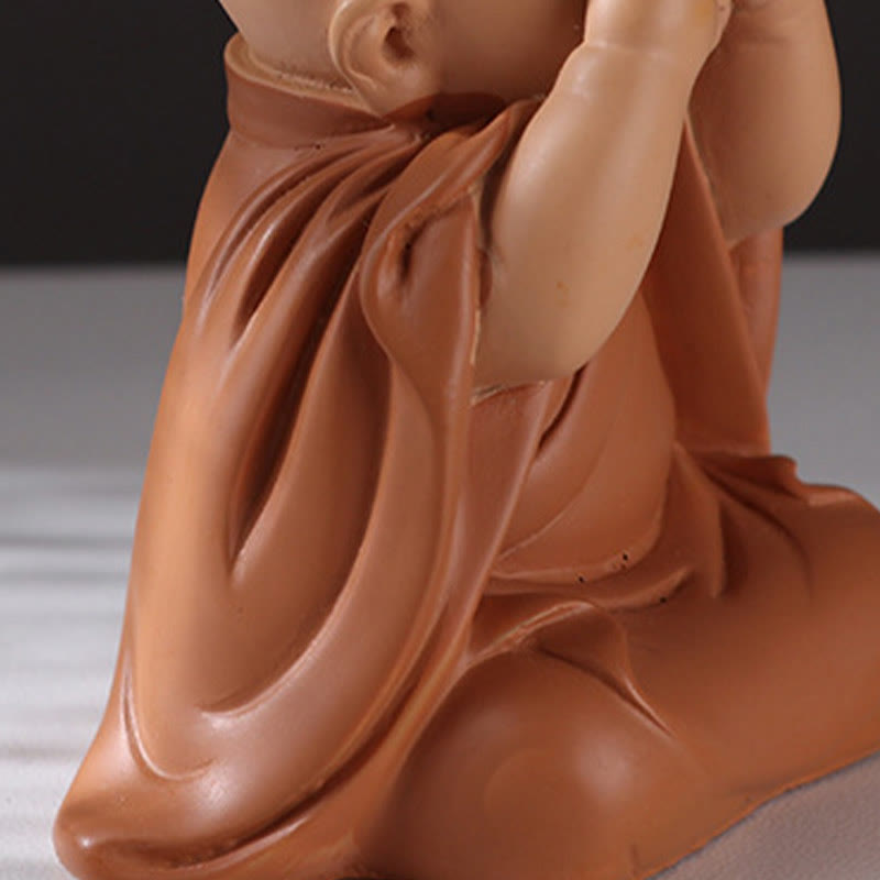 Mini Praying Monk Decor – monk on bookshelf between classics, scholarly meditation corner setup