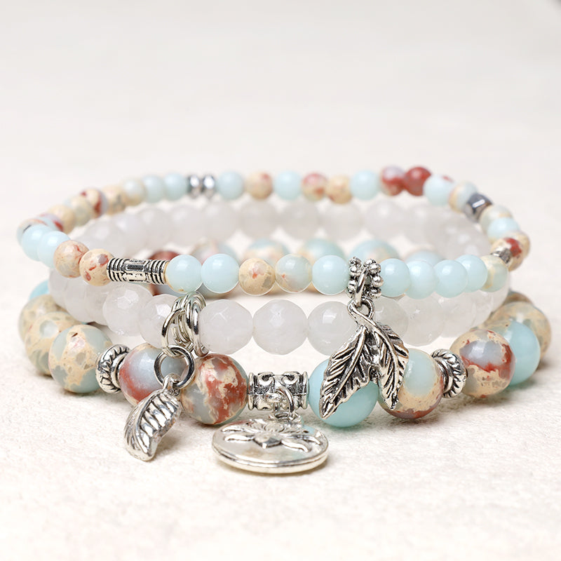 Crystal Lotus Bracelet – aqua jasper and frosted white quartz three-layer stack with lotus pendant, crystal bracelet