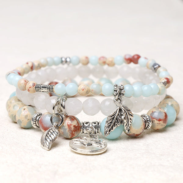 Crystal Lotus Bracelet – aqua jasper and frosted white quartz three-layer stack with lotus pendant, crystal bracelet
