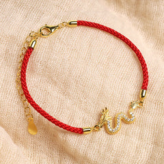 925 Silver Dragon Bracelet - Dragon charm on red cord with extender on beige fabric, spiritual gift