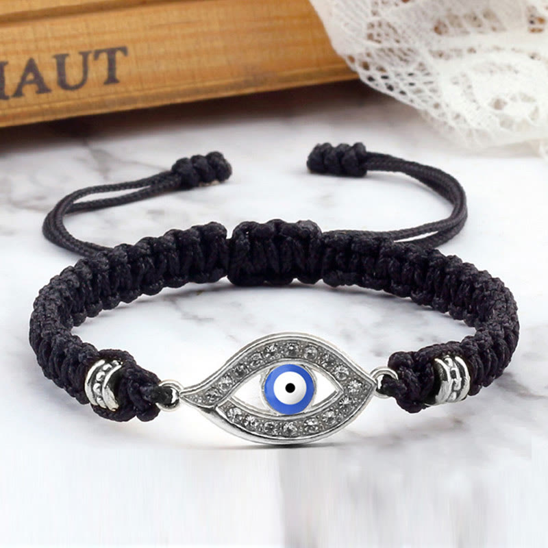Black cord evil eye bracelet with silver blue evil eye pave charm, marble lifestyle