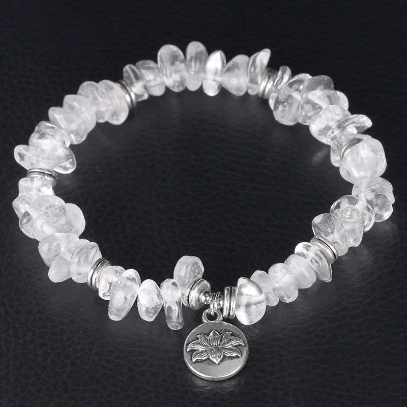 Natural White Crystal Lotus Bracelet – Overhead view highlighting quartz clarity and silver spacers