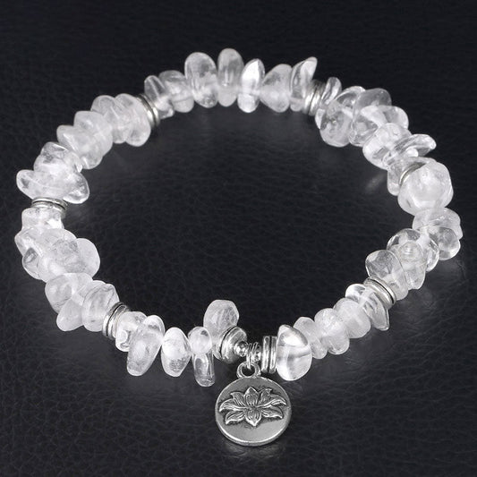 Natural White Crystal Lotus Bracelet – Overhead view highlighting quartz clarity and silver spacers