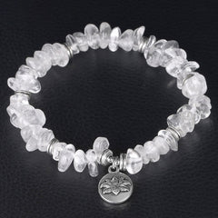 Natural White Crystal Lotus Bracelet – Overhead view highlighting quartz clarity and silver spacers