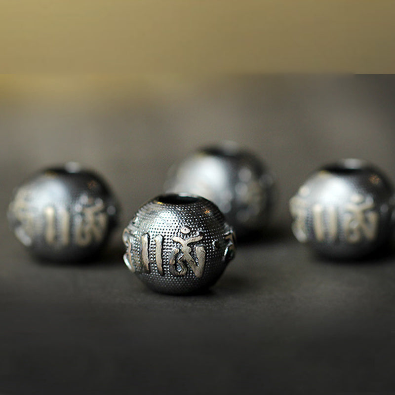 Zodiac Natal Buddha Obsidian Silver Bracelet - Four Tibetan mantra beads with embossed script detail