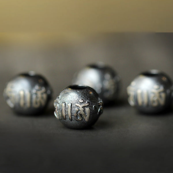 Zodiac Natal Buddha Obsidian Silver Bracelet - Four Tibetan mantra beads with embossed script detail
