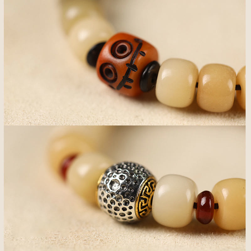 Natural Bodhi Seed Om Mani Padme Hum Wisdom Bracelet - Macro dzi eye and silver charm detail