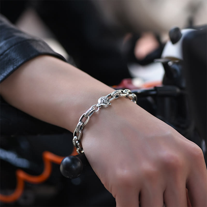 Double Dorje Wisdom Bracelet - On wrist with black leather jacket, biker lifestyle silver bracelet