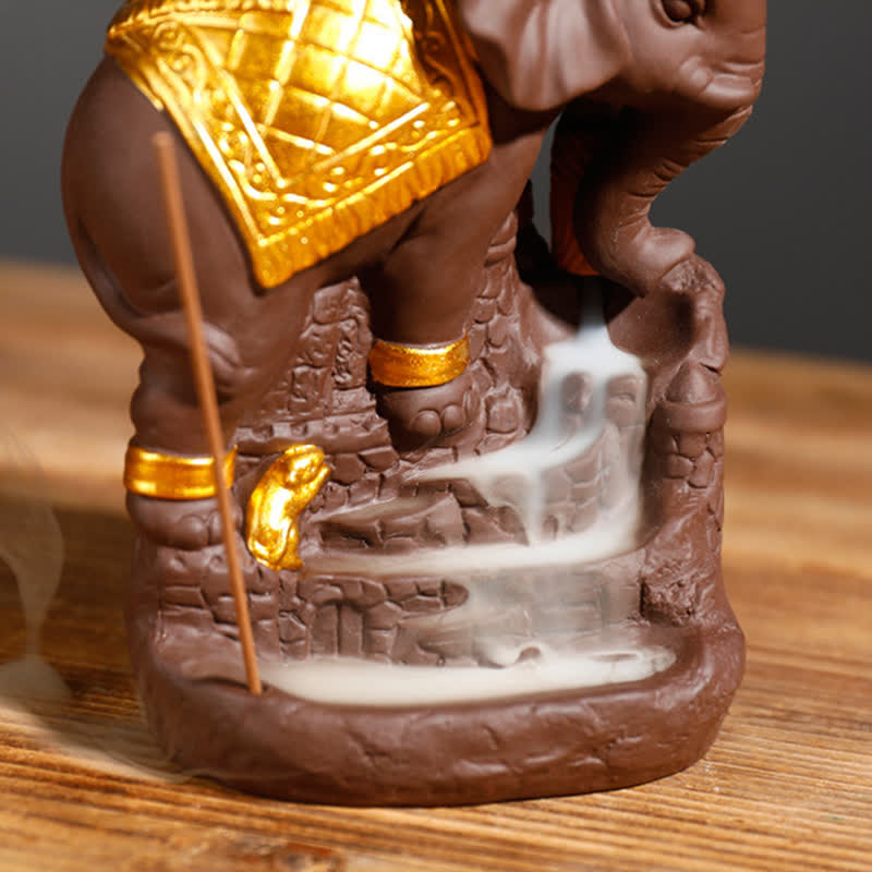 Elephant Incense Burner Detail – Tight close-up of elephant head with raised trunk and flowing smoke, dark ceramic