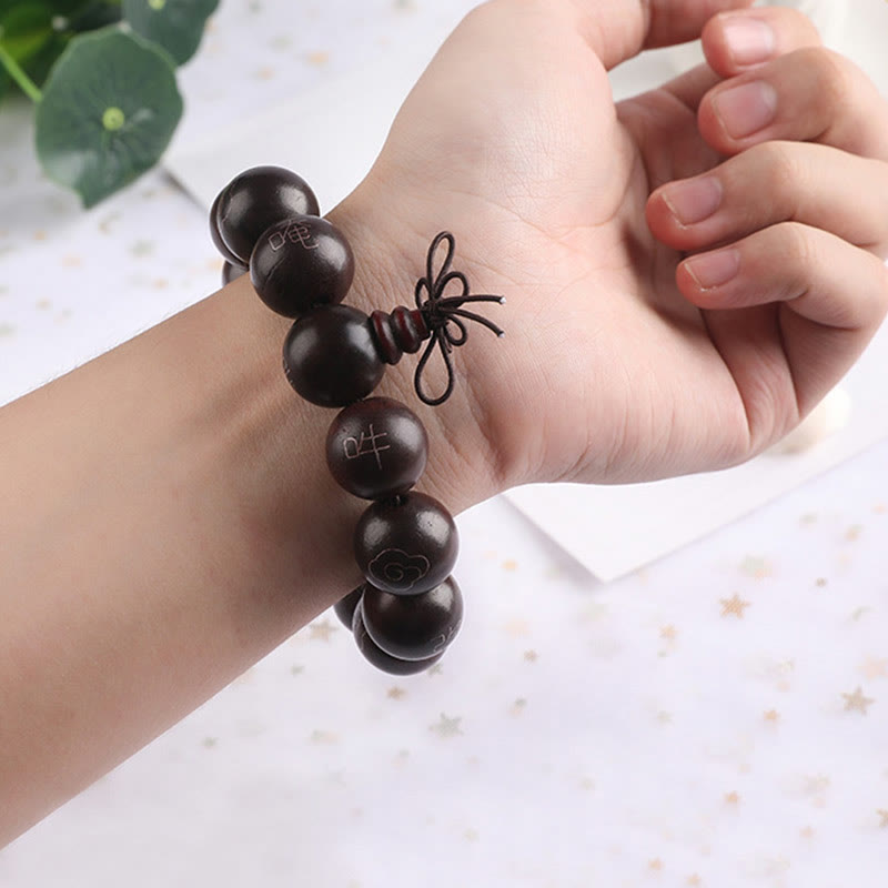 Sterling Silver Sandalwood Mantra Bracelet – worn on wrist in bright lifestyle setting, wrapped prayer beads