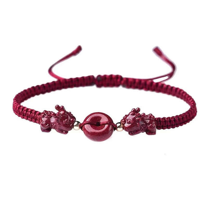 Cinnabar PiXiu Copper Coin Red String Bracelet – Isolated red cord bracelet with cinnabar PiXiu on white, adjustable