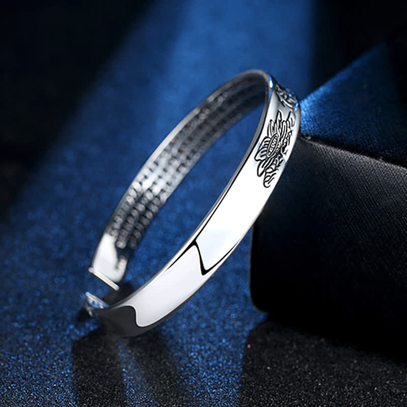 Heart Sutra Lotus Copper Cuff Bracelet - engraved lotus silver cuff with spotlight on navy fabric, Tranquil beauty