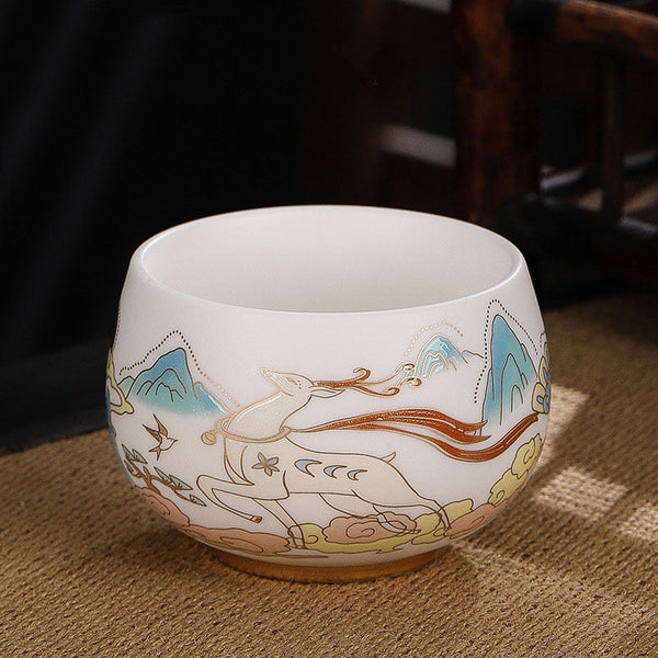 Dragon Cicada Ceramic Tea Bowl - gilded celestial deer with turquoise mountains and flowing ribbon on white jade porcelain