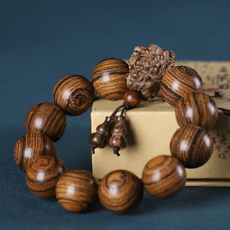 Multi-Wood Dragon Bracelet - Tiger-stripe wood beads with carved lotus and gourd pendants, Serenity