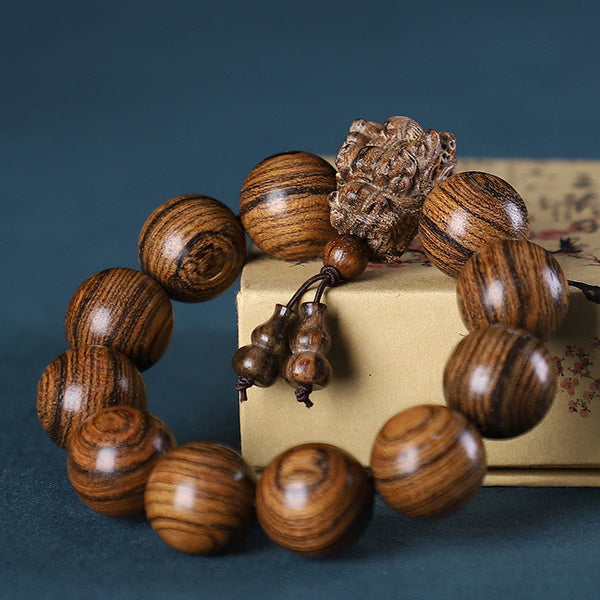 Multi-Wood Dragon Bracelet - Tiger-stripe wood beads with carved lotus and gourd pendants, Serenity