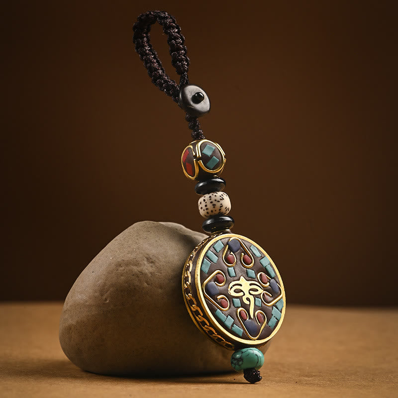 Tibetan Bodhi Seed Peace Key Chain – Central Om symbol with turquoise red inlay on cord and bodhi seed bead