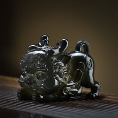 Color Changing PiXiu Tea Pet – Black glossy PiXiu figurine on dark wood tea tray