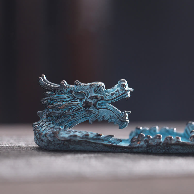Dragon Alloy Incense Burner - Aged bronze dragon side profile on gray surface, powerful