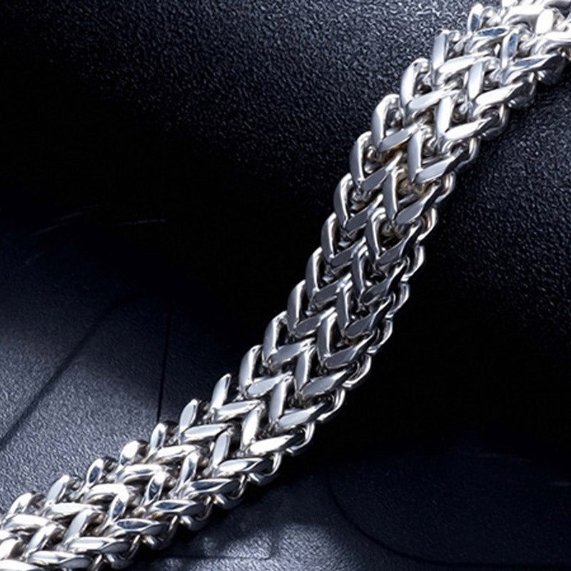 Fish Scale Titanium Steel Magnetic Bracelet – silver foxtail chain on black leather, macro diagonal close-up, shallow depth