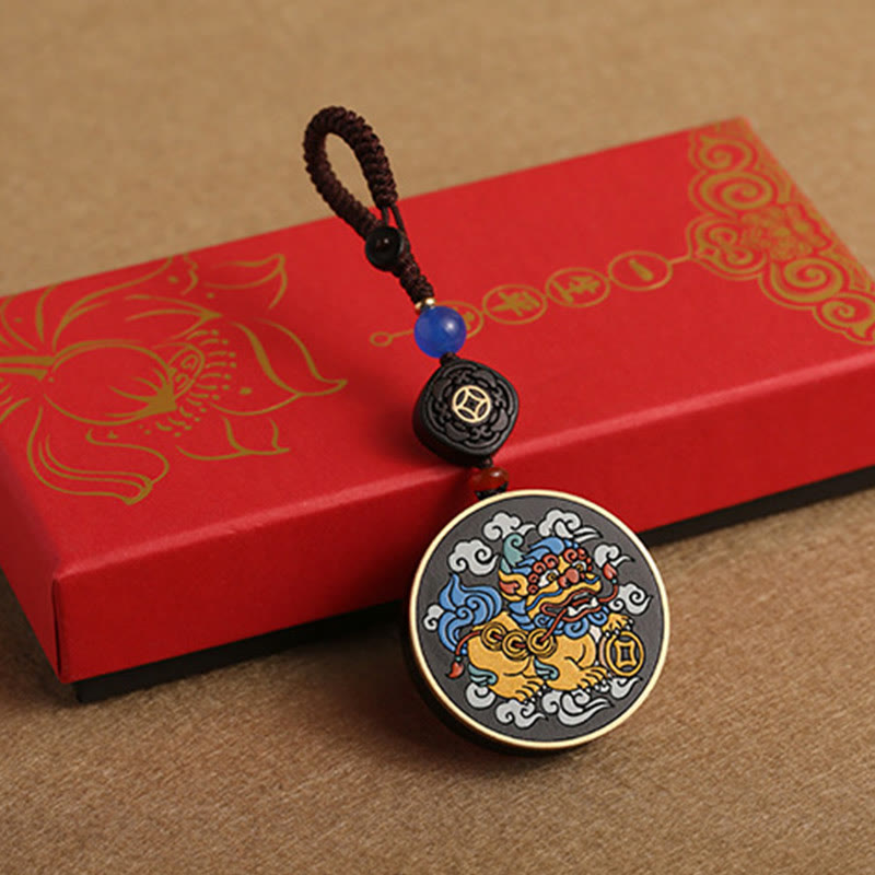 PiXiu Coin Keychain – On red gift box with gold lotus pattern, festive wealth charm