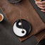 Yin Yang Incense Holder – Burning incense with smoke on dark stone, tea ceremony setting, Tranquil