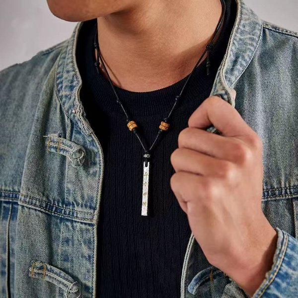 Tian Peng Chi Pendant – man wearing black cord ruler necklace with denim jacket, lifestyle shot, spiritual authority protection amulet