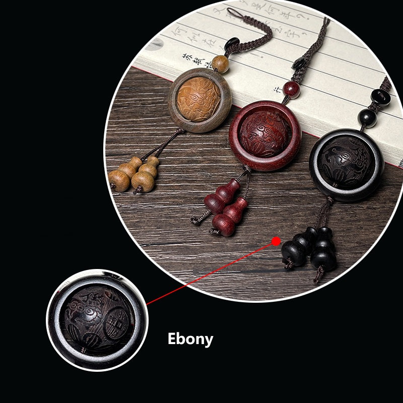 Feng Shui Sandalwood Keychain with Luminous Bead – Three wood variations on wood surface, Bloodwood carved fortune pattern detail