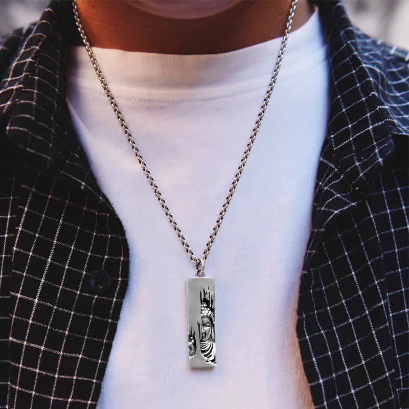 Tathagata Buddha Copper Amulet Necklace – man wearing pendant over white tee and plaid jacket outdoors, model-wear, strength