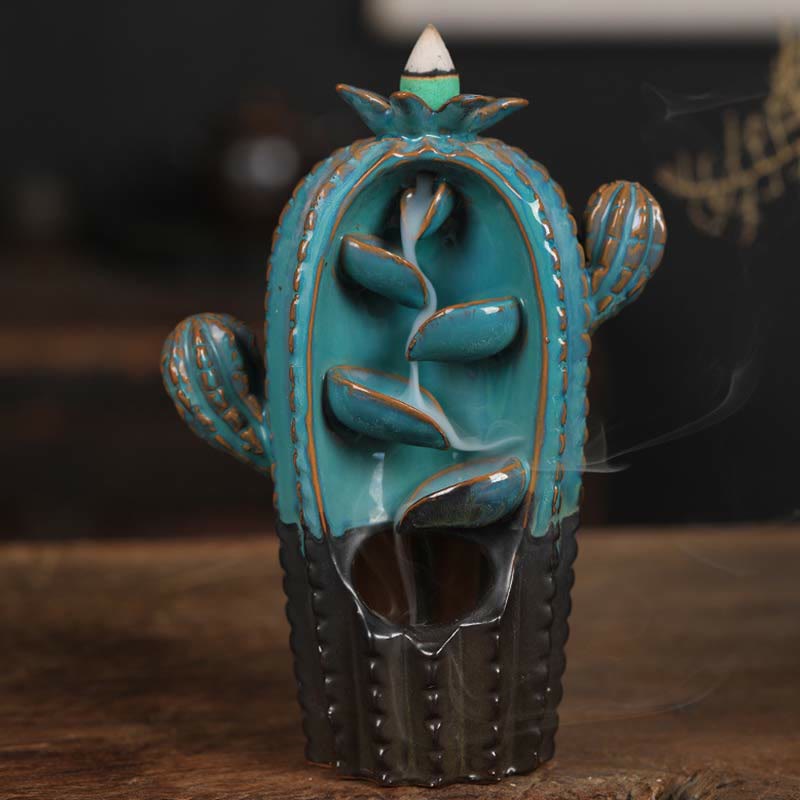 Cactus Backflow Incense Burner – turquoise saguaro with cascading smoke on wood, backflow incense burner