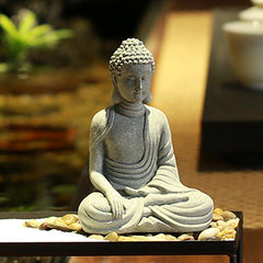 Sitting Meditation Buddha Sandstone Statue – close-up zen tray, pebbles, earth-touching, calm