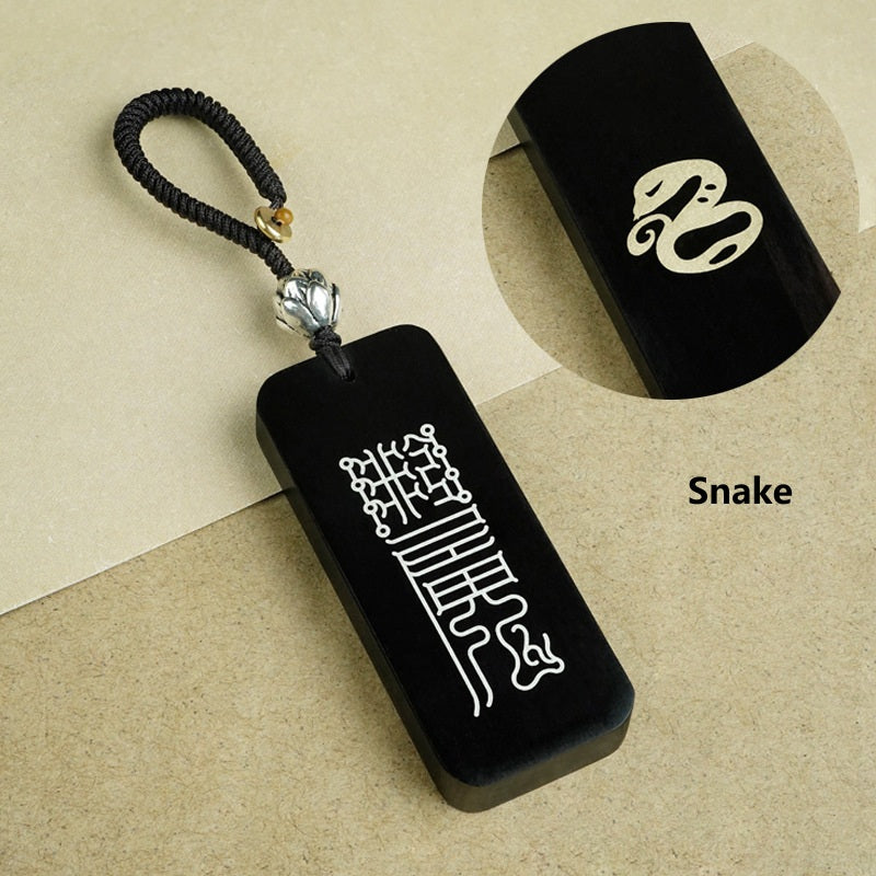 Ebony Big Dipper zodiac keychain with silver inlay Dog symbol and celestial script