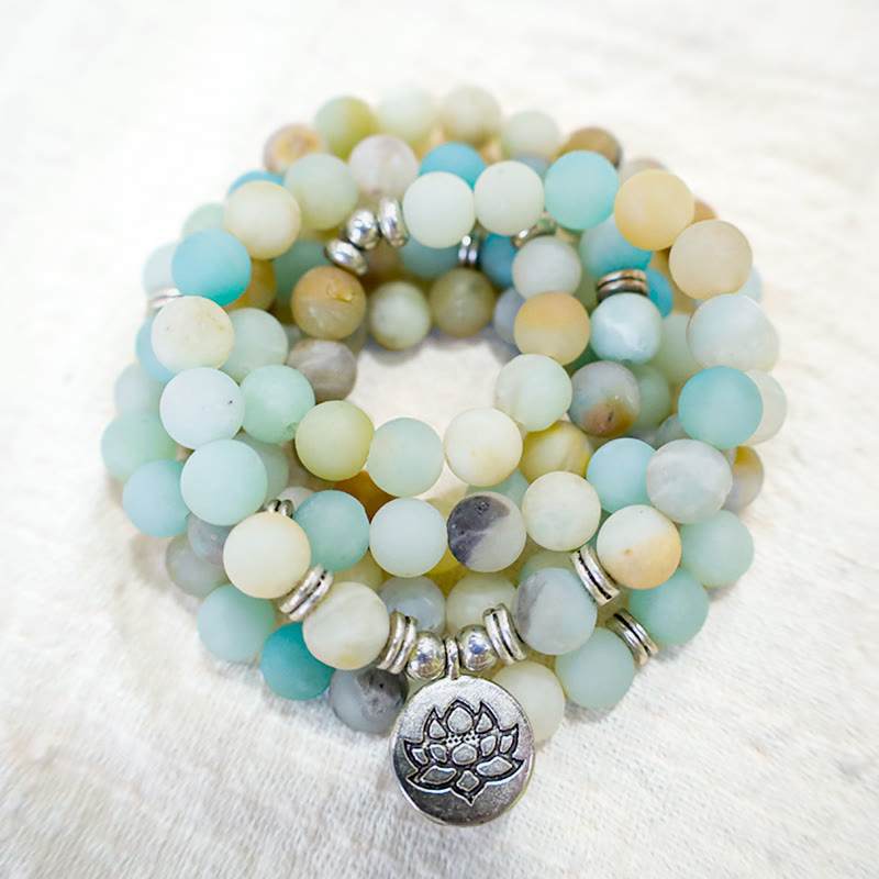 Amazonite Lotus Mala – wrap bracelet with silver spacers on plush white surface, amazonite beads