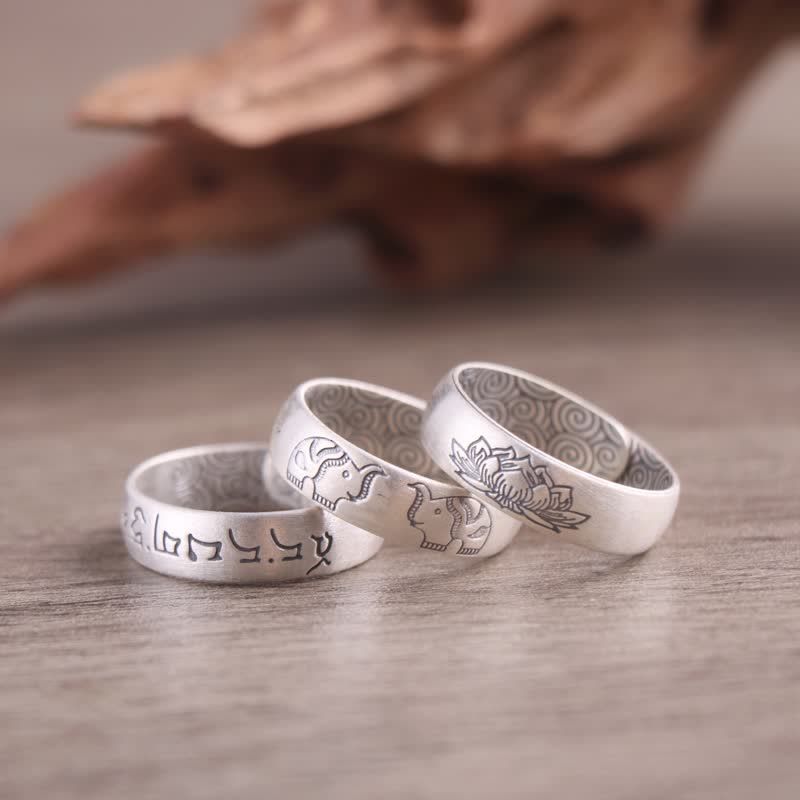 Sterling Silver Mantra Ring - three stacked bands on wood, lotus elephant and Tibetan, blessing