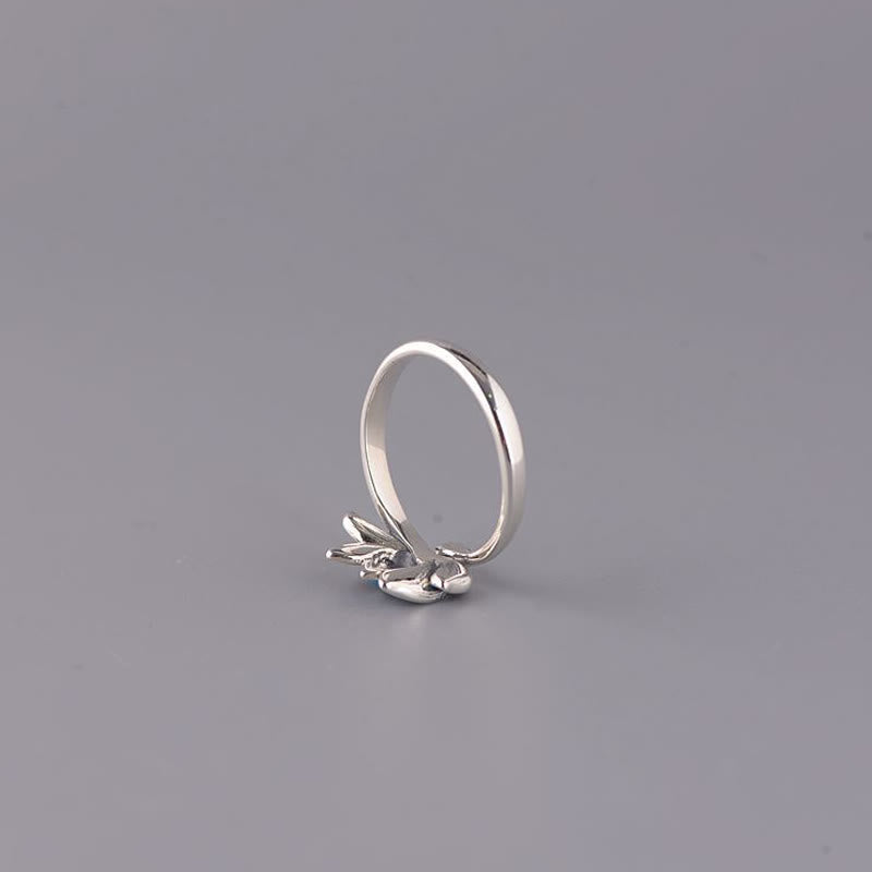 925 Sterling Silver Lotus Ring - Upright profile showing botanical leaf cluster on polished band, silver ring