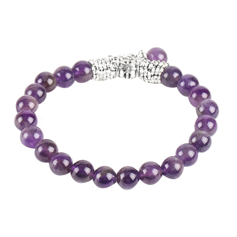 Tree of Life amethyst bracelet with purple gradient beads from deep violet to lavender, circular filigree tree pendant in antiqued silver.