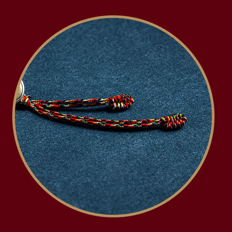 Chinese Zodiac Natal Buddha Bracelet – Multicolor braided cord tassel with interwoven red yellow green threads and knotted ends, circular display frame