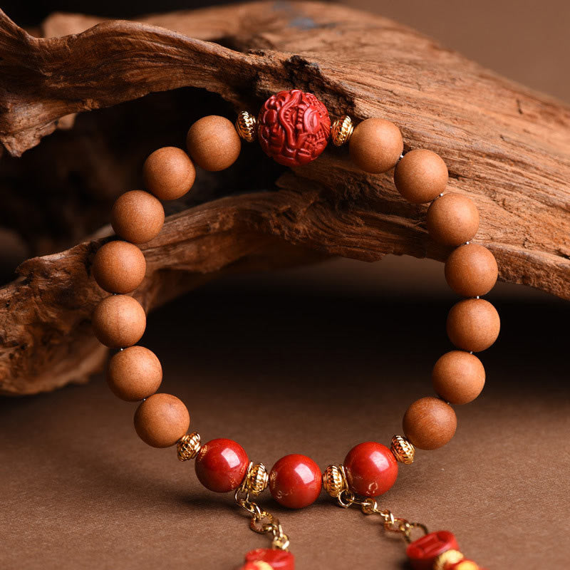 Peach Wood PiXiu Wealth Bracelet – Top-down view wood cinnabar bracelet with 5cm tassel, lucky charm