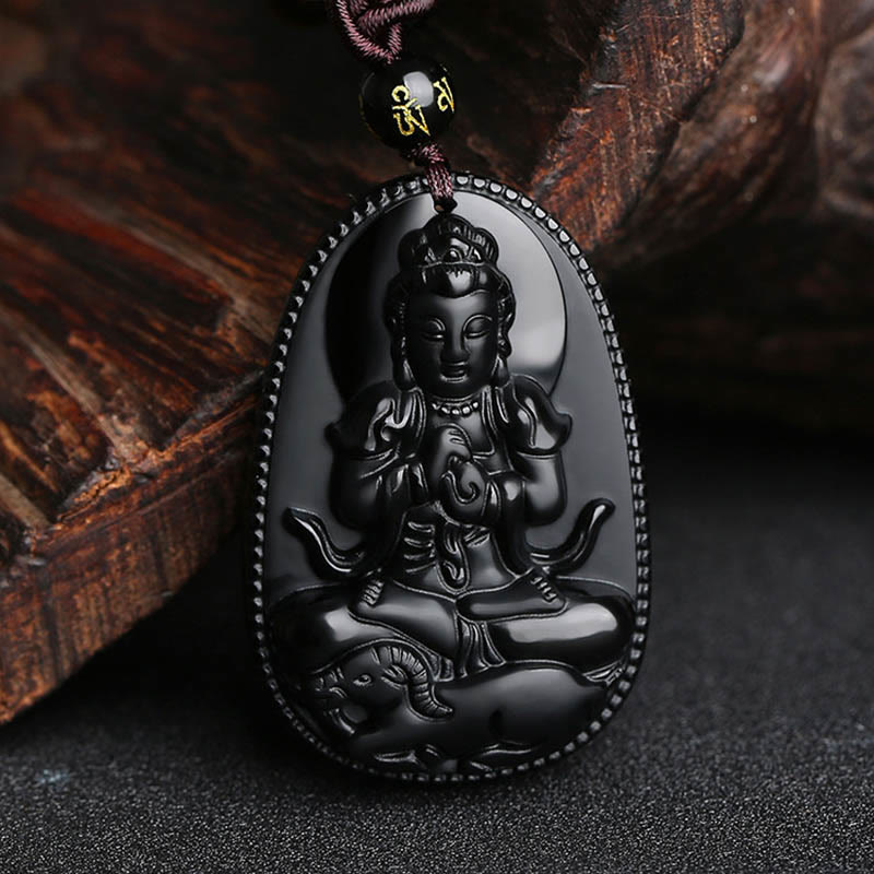 Chinese Zodiac Buddha Black Obsidian Necklace – Vairocana cosmic Buddha with wheel-turning mudra on obsidian, ornate crown and sashes, goat monkey zodiac deity