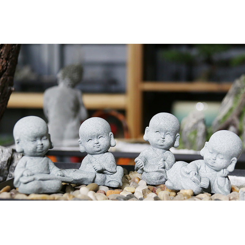 Meditation Monk Statue - Monk statue set arranged on stones with bookshelf background decor