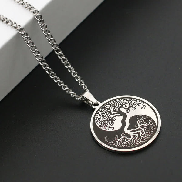 Tree of Life Titanium Steel Necklace – silver pendant on dark surface with white block, angled view, connection pendant