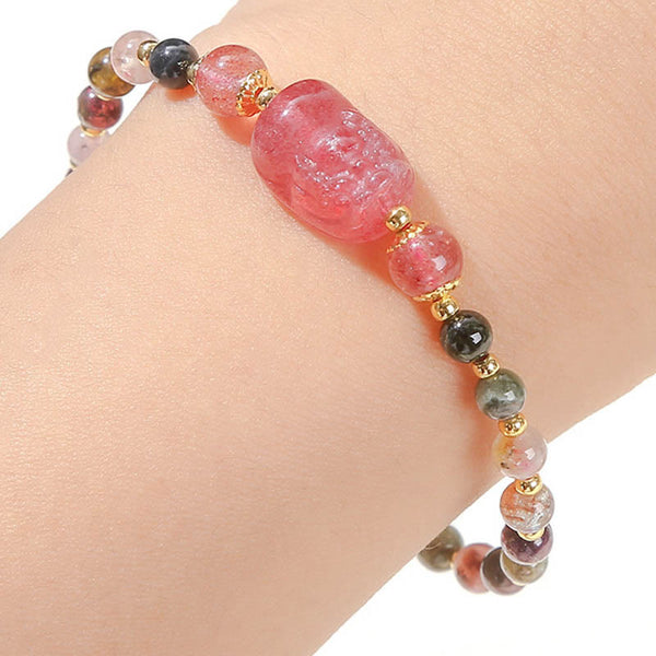 Moonstone Strawberry Quartz Tourmaline Bracelet – Tourmaline bracelet with strawberry quartz PiXiu worn on wrist, energy jewelry